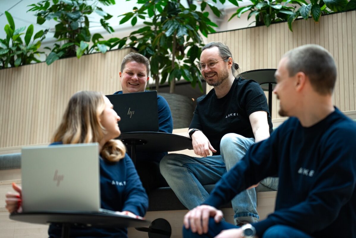 four arked employees chatting